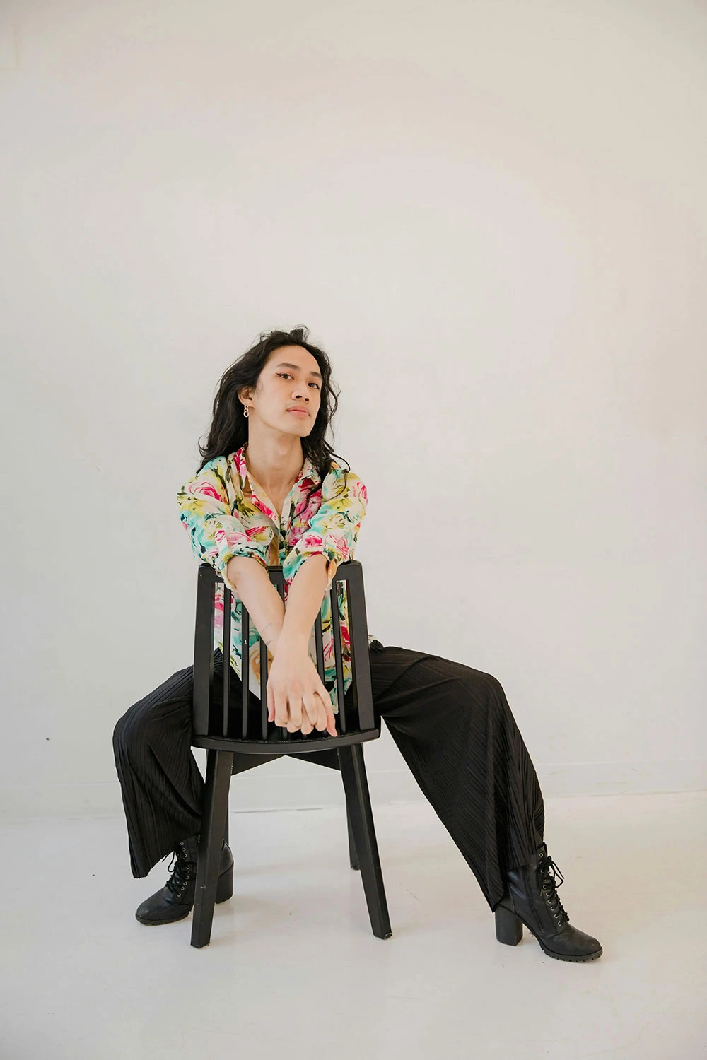 client posing on chair during editorial photoshoot at Spotlite Photography studio in Windsor